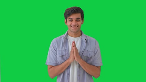 Cute-Indian-boy-doing-Namaste-and-greetings-Green-screen
