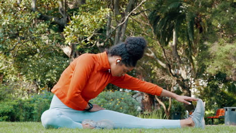 Black-woman-stretching-leg-in-the-park
