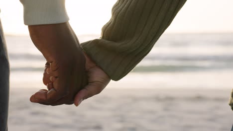 Trust,-love-and-holding-hands-with-couple-at-beach
