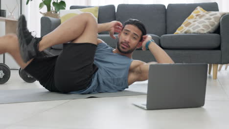 Fitness-man,-home-workout-and-laptop