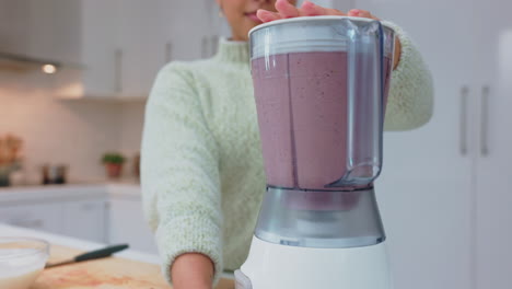 Woman-with-smoothie-drink-blender-for-healthy