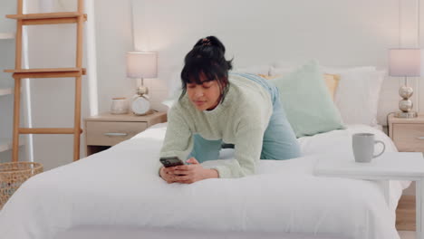 Bed,-phone-and-woman-text-and-relax