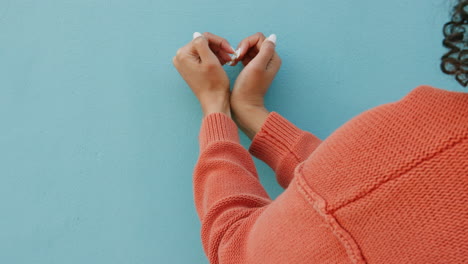 Heart-sign-with-hands-on-blue-city-wall-for-love