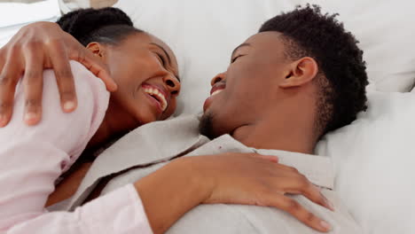 Happy,-love-and-couple-in-a-bedroom-laughing
