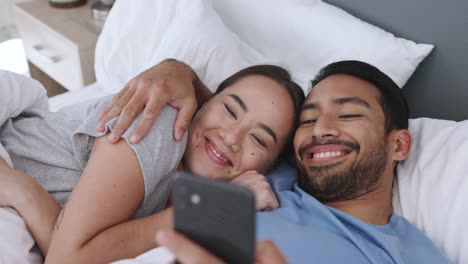 Funny-phone-social-media,-bed-with-a-couple-lying
