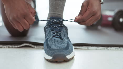 Man-hands,-shoelace-and-home-exercise-for-fitness