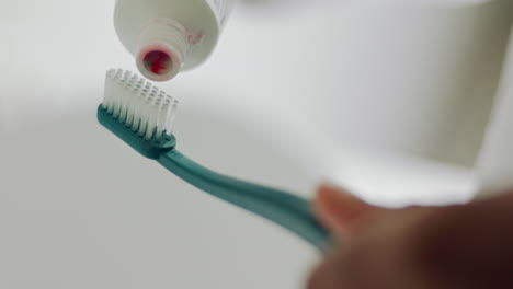 Toothpaste-hands-on-toothbrush