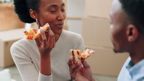 Couple-eating-pizza-and-talking-about-new-house