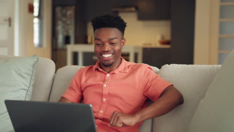 Satisfied-black-man,-laptop-and-sofa-in-happiness