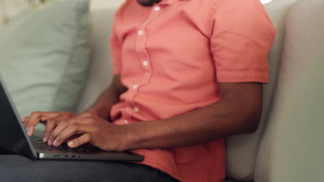 Black-man-stretching,-relax-from-typing-on-laptop