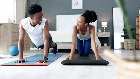 Black-couple-doing-a-workout-in-their-bedroom