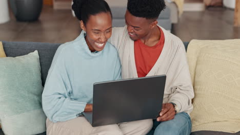 Black-couple,-laptop-and-home-sharing-kiss