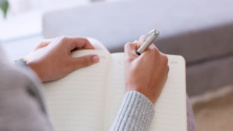Woman-hands-writing-in-notebook