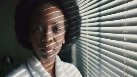 Face,-window-and-light-with-a-black-woman-standing