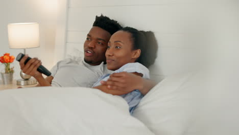 Bed,-television-and-couple-with-a-man