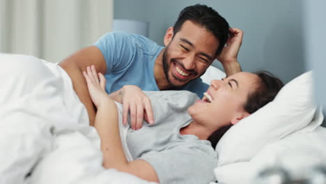 Couple,-laughing-and-love-bond-in-bedroom