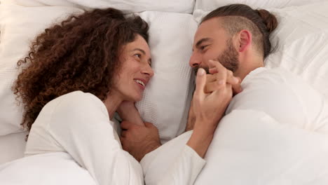 Couple-in-bed-together-talking