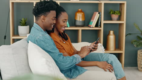 Internet,-technology-and-couple-with-phone-on-sofa