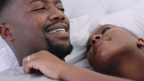 African-couple-talking-on-bed-in-morning