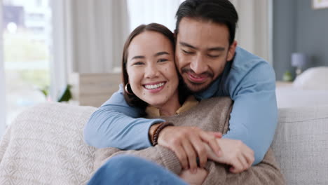 Love,-home-and-portrait-of-couple-hug-while-relax