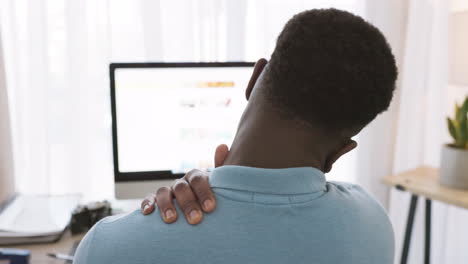 Black-man,-shoulder-pain-and-stress-working-on-pc