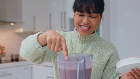 Woman-with-strawberry-smoothie-blender-drink