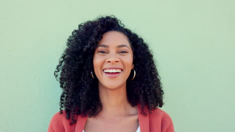 Smile,-laughing-and-happy-black-woman-on-green