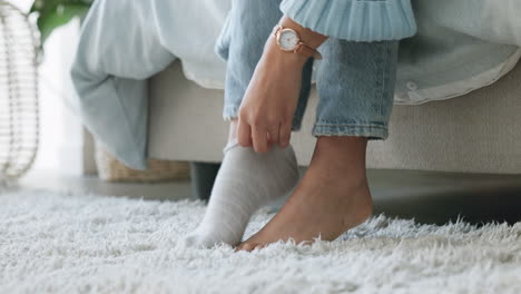 Woman,-hands-or-feet-in-winter-socks-in-house