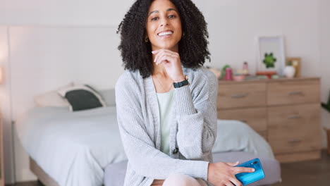 Happy-black-woman,-phone-and-relax-in-bedroom