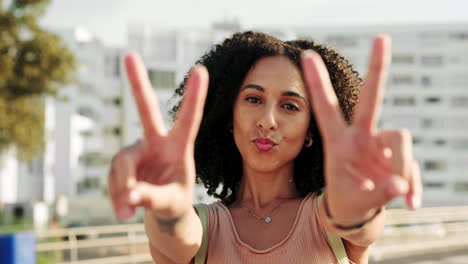 Black-woman,-smile-and-hands-peace-sign-in-city