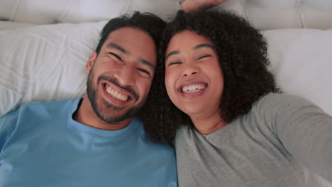 Selfie,-love-and-happy-influencer-couple-lying