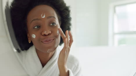 Face-sunscreen-or-cream-on-black-woman-in-bathroom