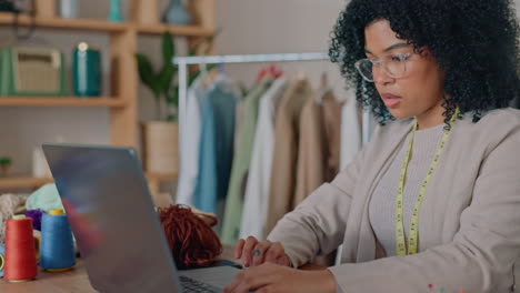 Black-woman,-laptop-or-fashion-designer-in-retail