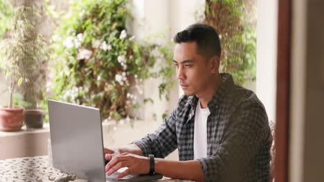 Asian-man,-laptop-and-SEO-freelancer-for-web