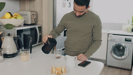 Man-at-table-in-kitchen-make-coffee-for-energy