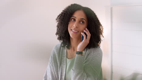 Happy-black-woman-talking-on-a-phone-call