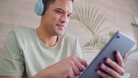 Happy-man,-digital-tablet-or-headphones-for-social