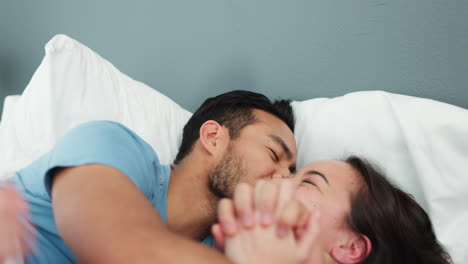 Young,-happy-and-playful-couple-in-bed