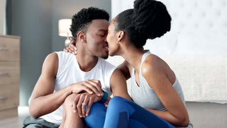 Couple-kiss-after-fitness-workout-in-house