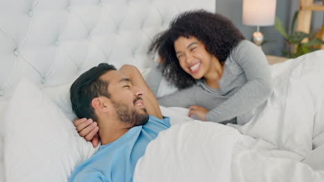 Couple-waking-up-in-bedroom-happy-happy