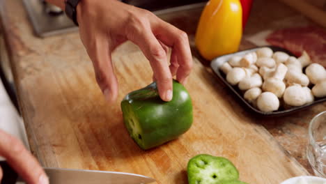 Chef-knife,-hand-and-cooking-pepper