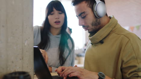 Creative-man,-woman-and-laptop-teamwork