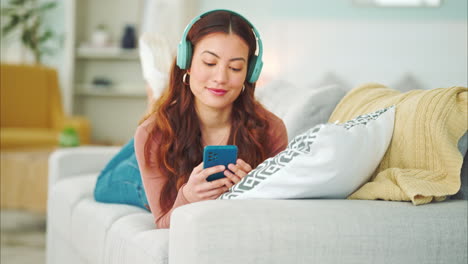 Relax,-music-and-phone-with-woman-in-living-room