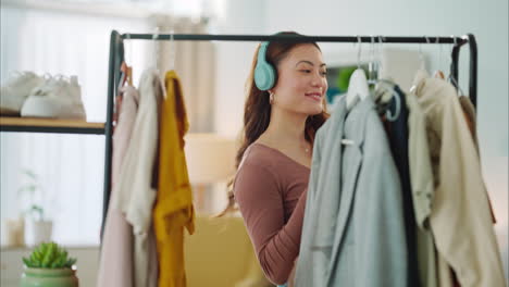 Woman,-closet-and-fashion-listening-to-music-dance