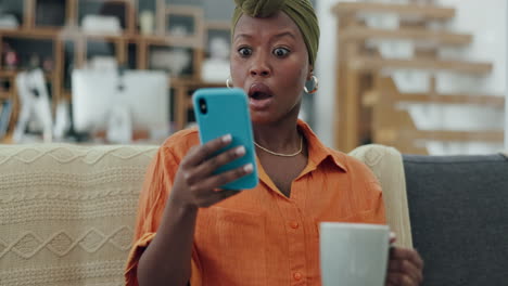 Phone,-coffee-and-shocked-black-woman-in-home