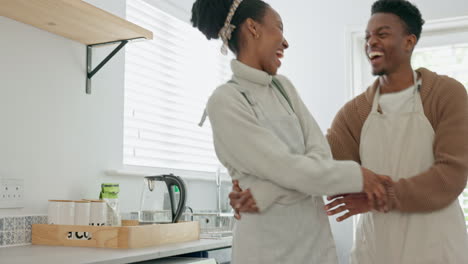 Black-couple,-dance-and-love-in-home-kitchen