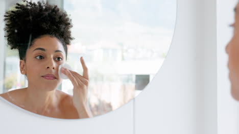 Black-woman,-swab-and-mirror-for-makeup-removal
