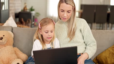 Laptop,-e-learning-and-mother-with-child-on-sofa
