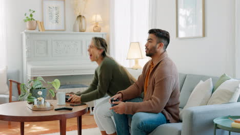 Winning,-celebrate-and-couple-gaming-on-the-sofa