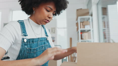 Black-woman,-shipping-box-and-warehouse
